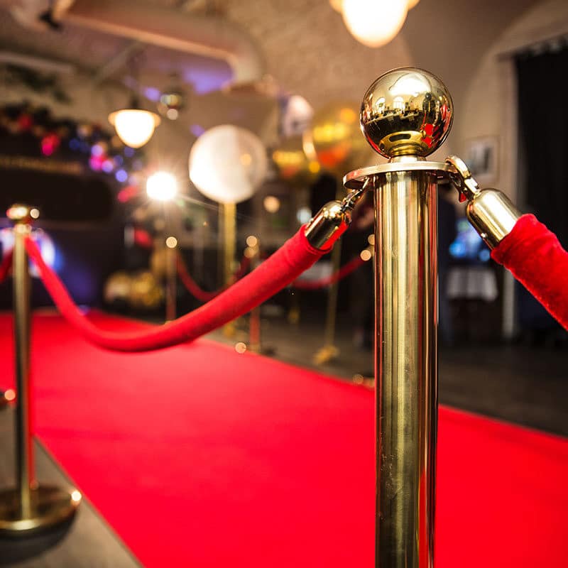 Red carpet with gold stanchions.